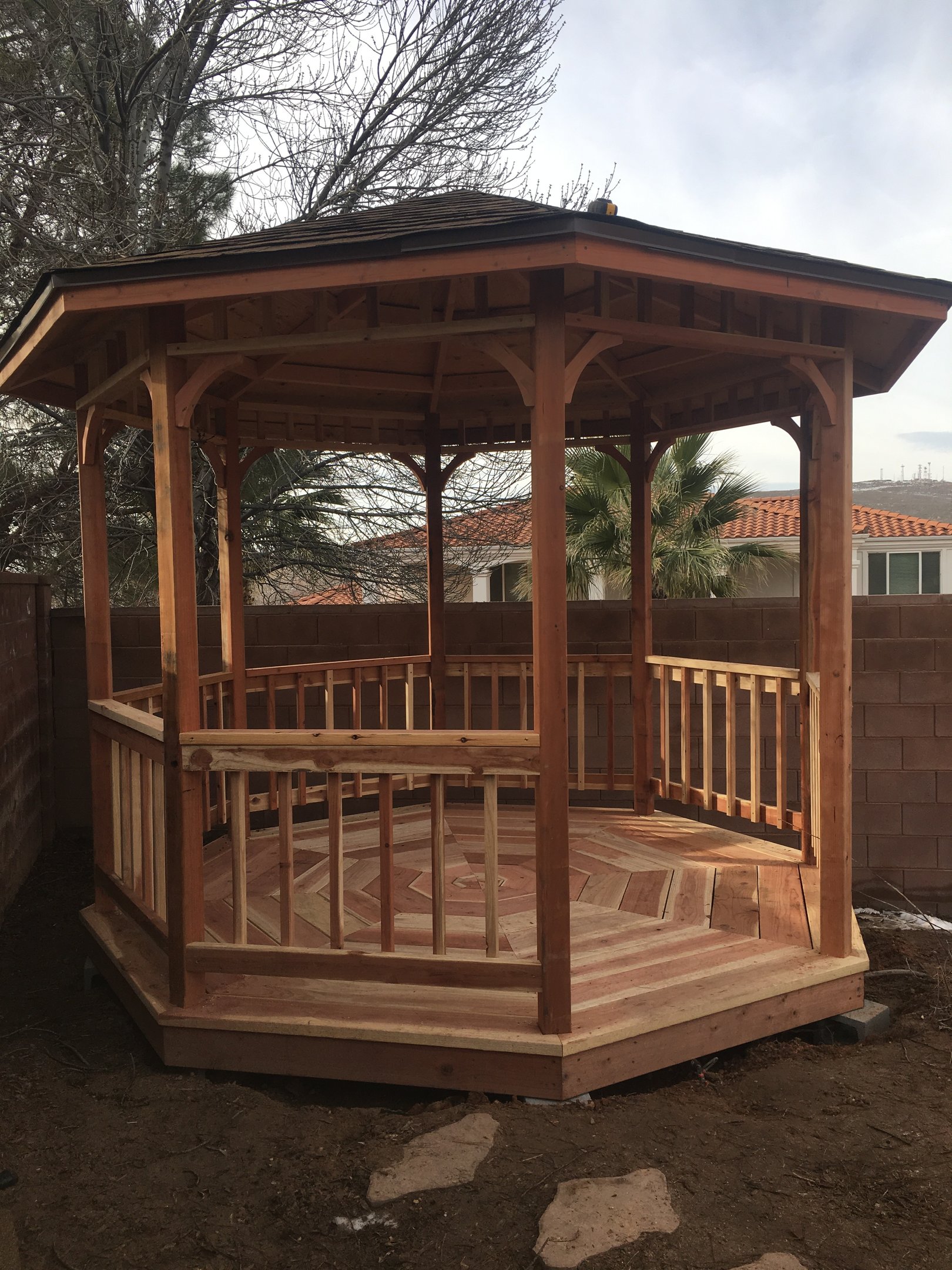 Cedar gazebo structure in an outdoor space