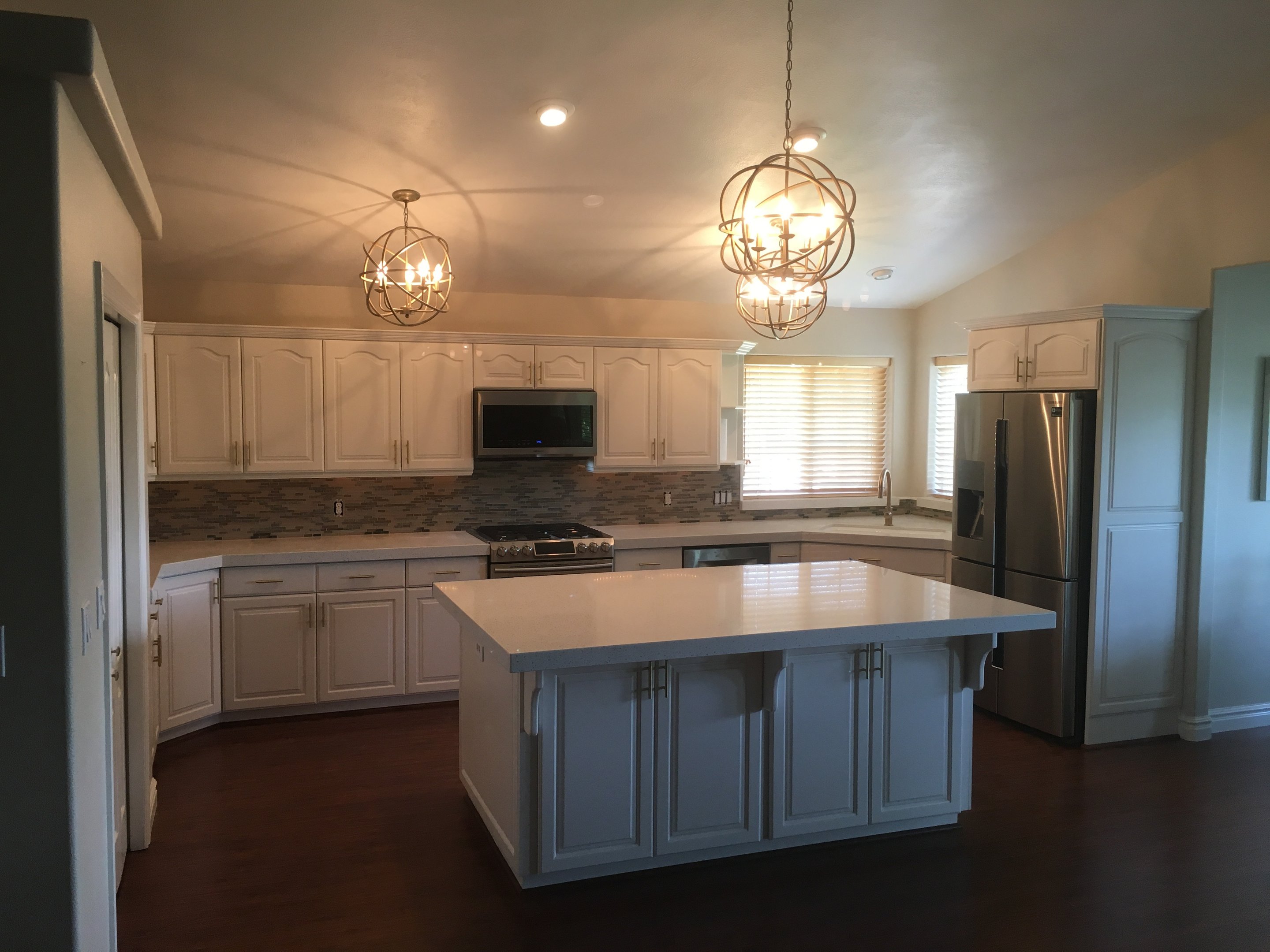 White kitchen cabinetry with custom lighting detail